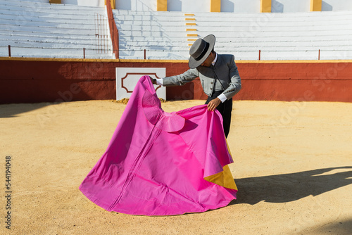 Spanish bullfighter with traditional cowboy suit and hat photo