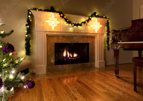 Natural gas insert heat fireplace glowing during the Christmas or New Year holiday