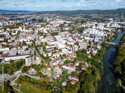 Aerial drone view of Banja Luka and river Vrbas, Bosnia and Herzegovina. Buildings, streets, parks and houses. City center of Banja Luka, view from above.  photo