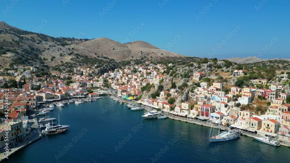 Symi is a Greek island, part of the Dodecanese island group. It’s known for its beaches, an annual music festival and for the harbor at Symi Town, surrounded by colorful neoclassical houses. Symi is a Greek island, part of the Dodecanese island group. It’s known for its beaches, an annual music festival and for the harbor at Symi Town, surrounded by colorful neoclassical houses.