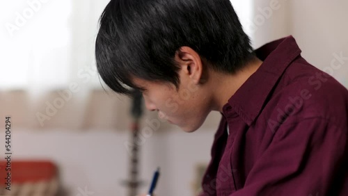 Asian student studying English at home. Exam, Test, Knowledge.