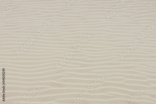 Abstract sand ripples background. Textured beach wallpaper. 