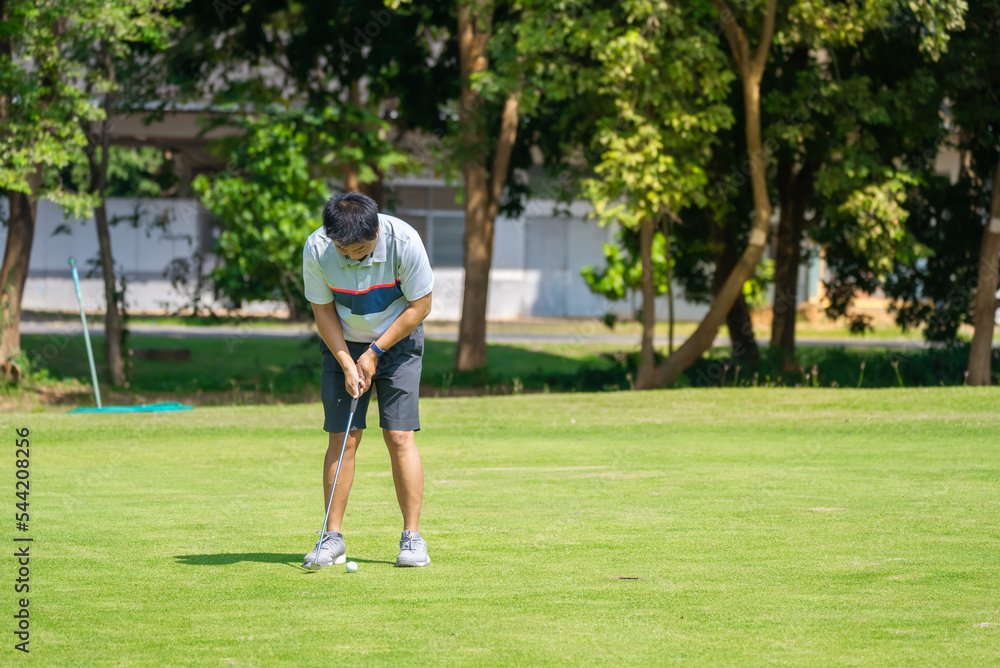 Golfer playing golf sport in golf course 