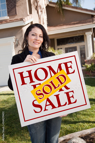 Woman Holding Sold Real Est...