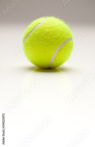 Single Tennis Ball on Gradation with Slight Reflection. © Andy Dean