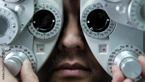 Eye exam at the ophthalmologist photo