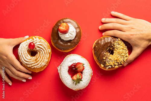 Delicious donuts with red background