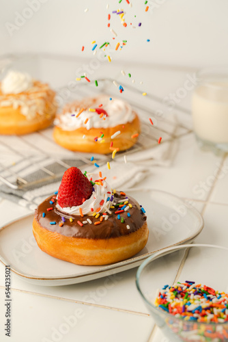 Homemade donuts with milk and sprinkles