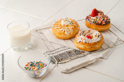 Homemade donuts with milk and sprinkles