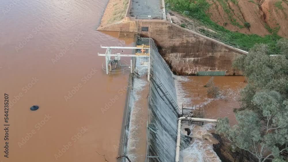 Flood waters cascading over a dam wall from a drone 11 Flood waters cascading over a dam wall from a drone 11