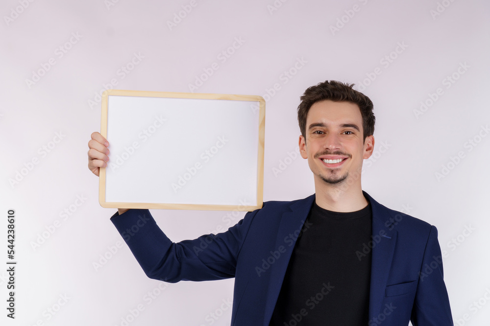 Portrait of happy businessman showing blank signboard on isolated white background Portrait of happy businessman showing blank signboard on isolated white background