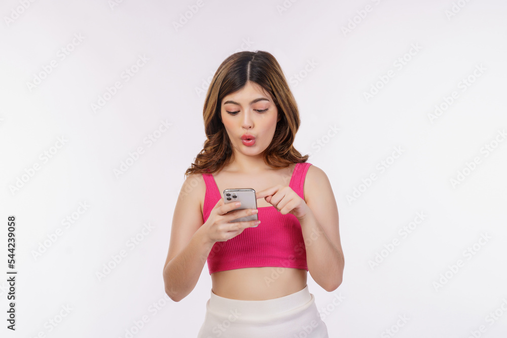 Portrait of excited young woman using mobile phone isolated over white background Portrait of excited young woman using mobile phone isolated over white background