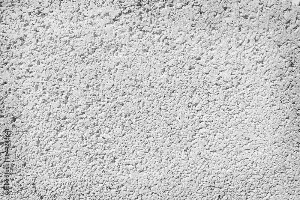 Rough surface of a concrete wall painted in greyish white, concrete wall background, blurred white background. Rough surface of a concrete wall painted in greyish white, concrete wall background, blurred white background.
