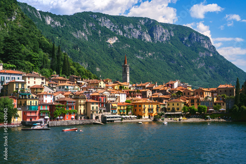Beautiful panorama of Varenna, one of the most famous and picturesque towns in Lombardy, Italy, with Alpine views, Italian villas overlooking the water, and botanical gardens along the shore.