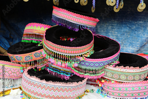 A variety of big traditional local hat, Hmong women for sale in market, Sapa (Sa Pa), Vietnam