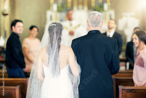 Wedding, event and father with bride at chapel for celebration, faith and marriage ceremony. Happy, family and church with dad and daughter walking in aisle for love, pride and Christian belief