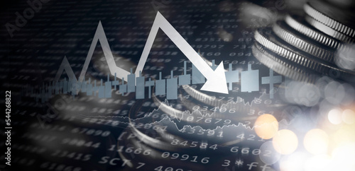 Double exposure image of coin stacks on technology financial graph background.Economy trends background for business ,financial meltdown ,Cryptocurrency digital economy.