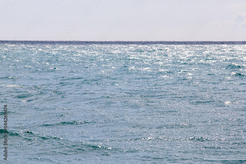 calm sea against the blue sky calm sea against the blue sky