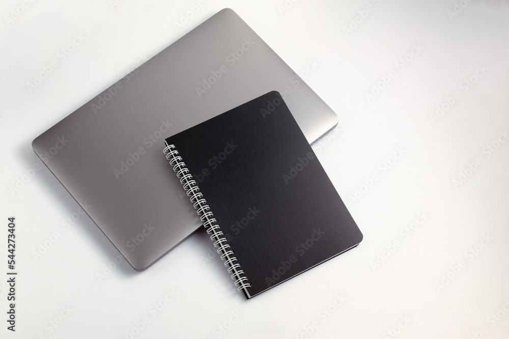 School notebook on a white background, spiral notepad on a table. flatlay School notebook on a white background, spiral notepad on a table. flatlay