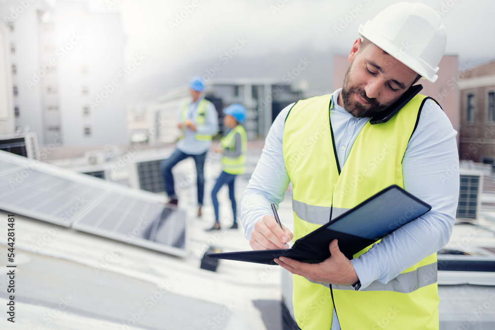 Solar energy, engineer phone call and man writing on solar roof working on inspection of electric solar panels. Renewable energy, checklist and male contractor on 5g mobile discussing project details Solar energy, engineer phone call and man writing on solar roof working on inspection of electric solar panels. Renewable energy, checklist and male contractor on 5g mobile discussing project details