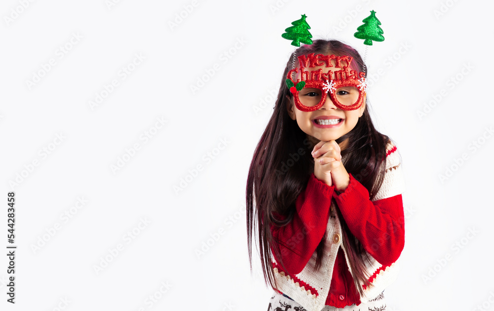 Little asian kid in red sweatshirt Christmas theme fancy costume posing on white background.