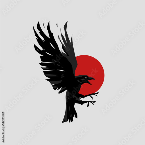 The raven opened its wings and trampled its paws against the background of the red sun.