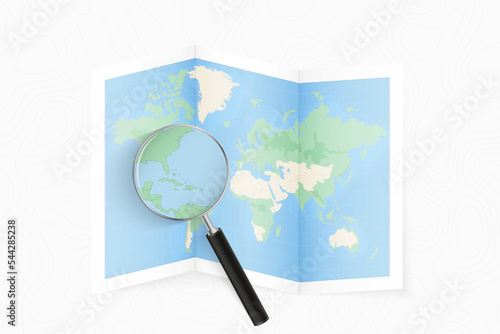 Enlarge The Bahamas with a magnifying glass on a folded map of the world.