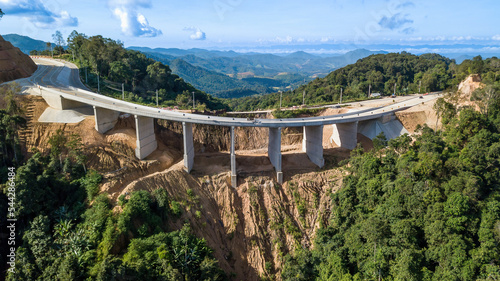 aerial drone top view of Ban Kat Samakkee Bridge across the Yuam River  Mae Sariang District  Mae Hong Son in Thailand.To help transport agricultural crops between the two banks of the river