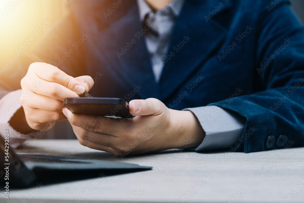 businesswoman hand working with laptop computer, tablet and smart phone in modern office with virtual icon diagram at modernoffice in morning light businesswoman hand working with laptop computer, tablet and smart phone in modern office with virtual icon diagram at modernoffice in morning light