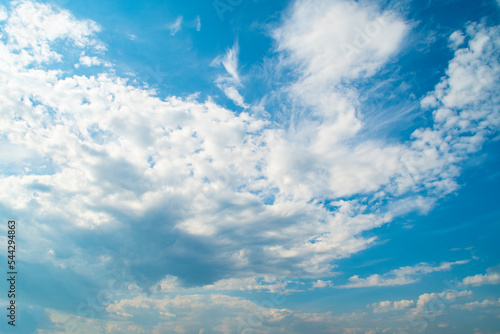 Background with blue sky and white clouds.