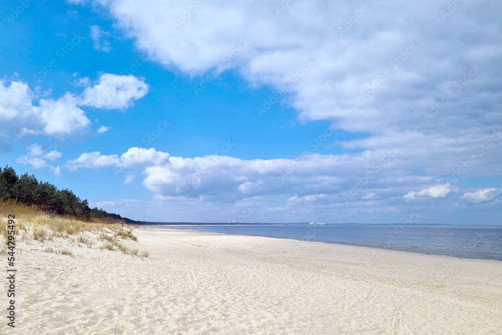 Empty sandy seashore on a sunny day.