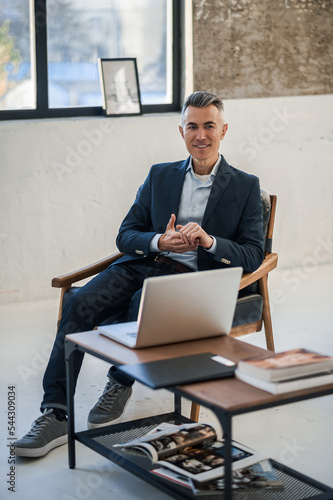 Caucasian businessman sitting in the office and working