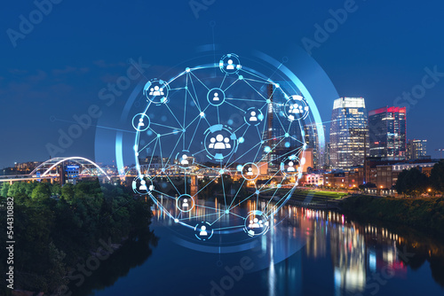 Panoramic view of Broadway district of Nashville over Cumberland River at illuminated night skyline, Tennessee, USA. Social media icons. The concept of networking and establishing people connections