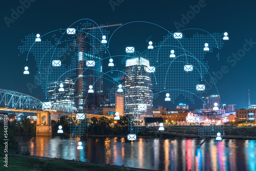 Fototapeta Naklejka Na Ścianę i Meble -  Panoramic view of Broadway district of Nashville over Cumberland River at illuminated night skyline, Tennessee, USA. Social media icons. The concept of networking and establishing people connections