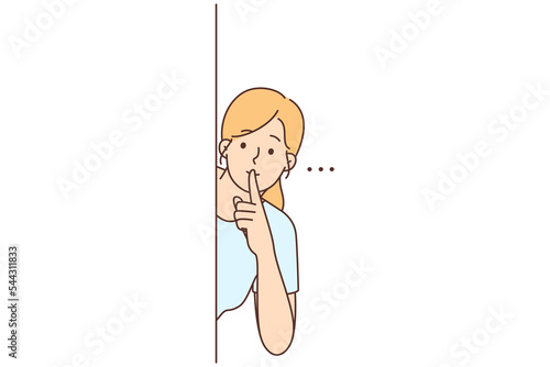 Young woman show hush hand gesture 