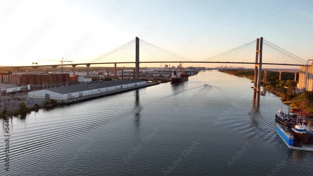 Aerial establishing shot of Savannah River in Georgia. Talmadge Bridge at sunset. Aerial establishing shot of Savannah River in Georgia. Talmadge Bridge at sunset.