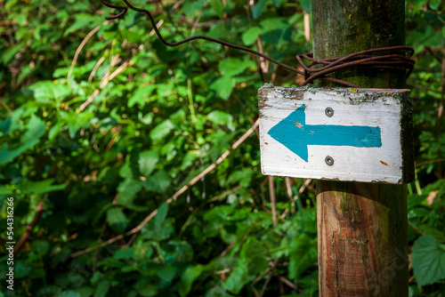 Uriage les Bains France 11 2022 directional sign with a blue arrow