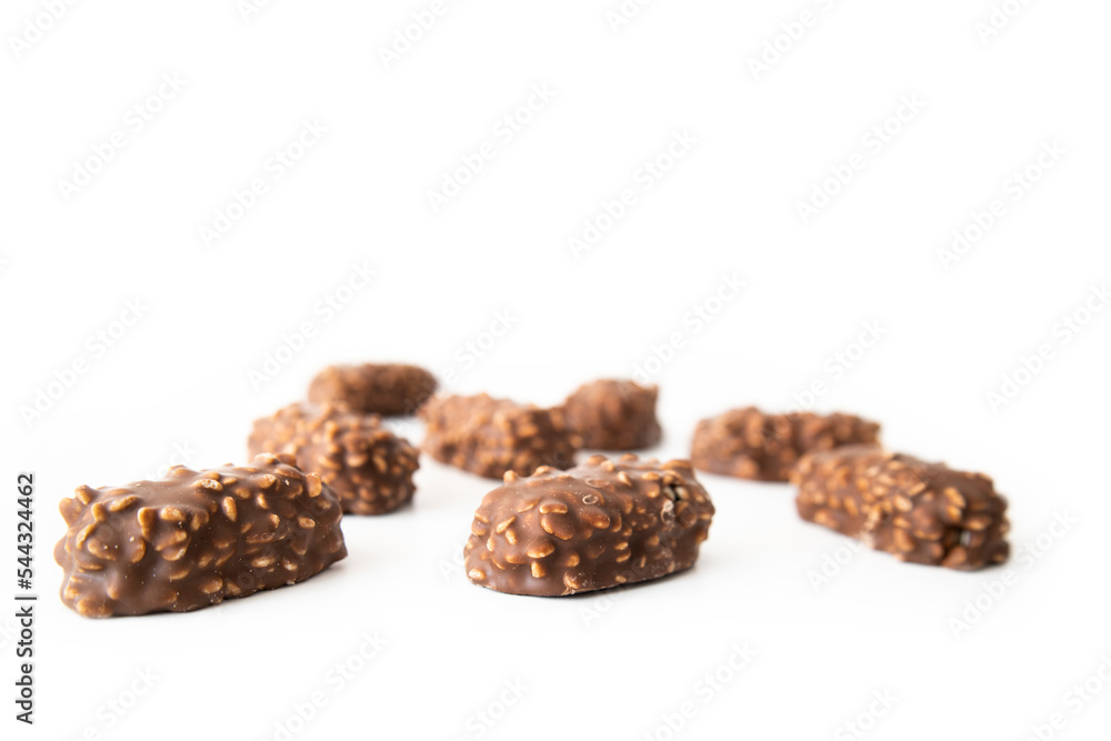 Chocolate bars with handmade wafers lie on a white background Chocolate bars with handmade wafers lie on a white background