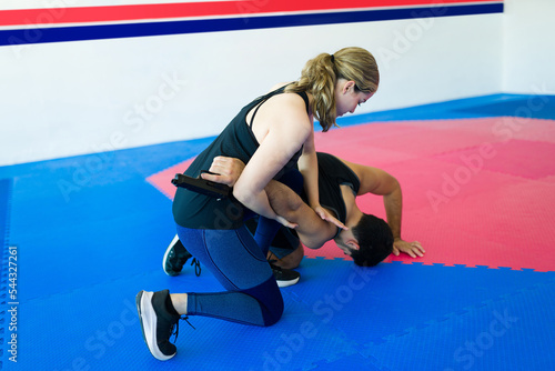 Young woman learning during a personal defense practice