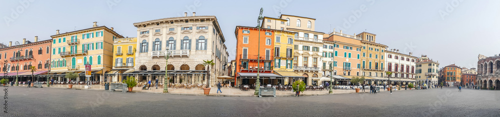 Extra wide view of The beautiful Square Brà in Verona with houses with colored facades