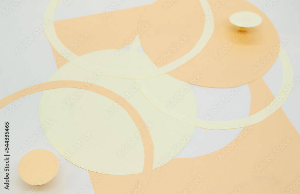 Abstract background with 3D paper elements in beige, orange colors resembles female forms - chest, abdomen. Backdrop advertising products, copy space Abstract background with 3D paper elements in beige, orange colors resembles female forms - chest, abdomen. Backdrop advertising products, copy space