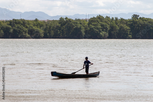 canoe on river, in Vitoria, Espirito Santo, Brazil