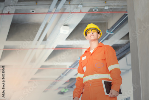 Portrait  Engineer  Industrial  In the Background Industrial Factory . photo