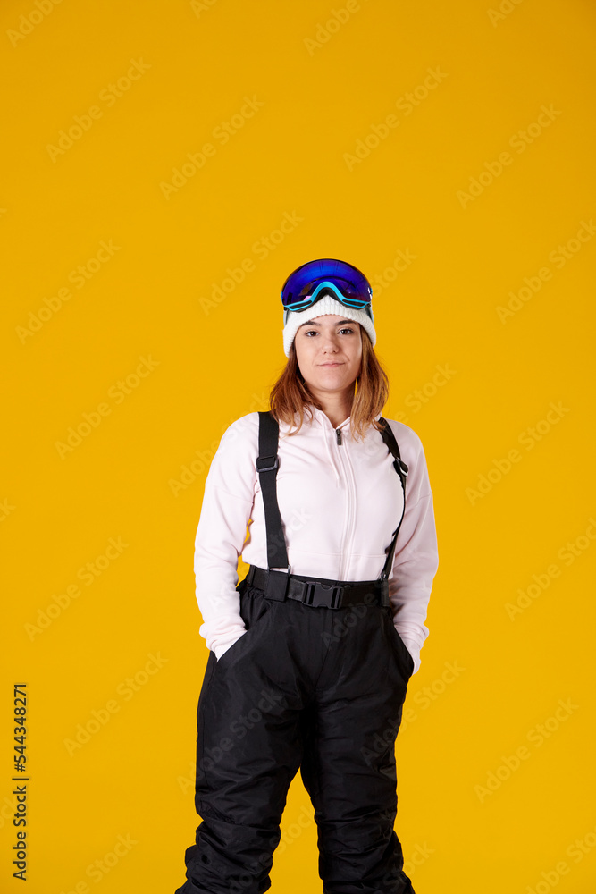 woman in snowboard clothes with hands in pockets