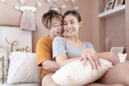 Asian lesbian couple, LGBTQ. Happy Two young Asia women showing love and romance together at home. Positive mood and moment of LGBT lesbian.