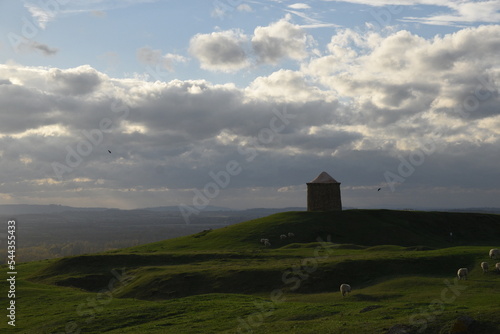 the rolling hills of Burton Dassett with the remains of an old windmill standing as a beacon on the summit