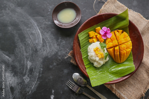 mango sticky rice is Thai dessert made of sticky rice, mango and coconut milk.