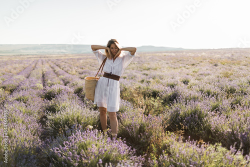 girl walking in lavender fields, beautiful blooming lavender field