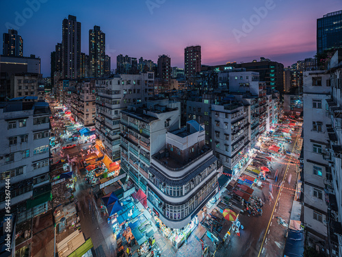 HONG KONG - July 28: Main street with many stalls in Sham Shui Po, Hong Kong on July 28, 2022. It is one of the poor district in Hong Kong.
