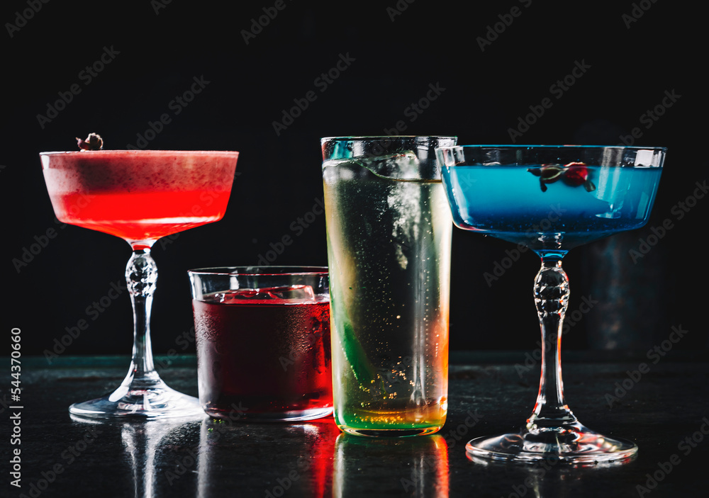 Cocktails glasses assortment served on dark background